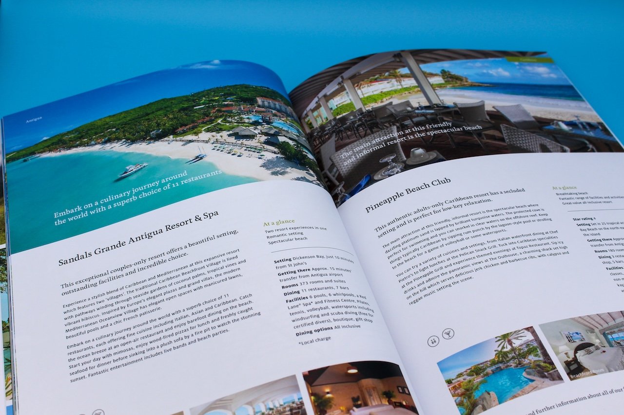 an open travel brochure with images of sandy beach resorts and supporting information